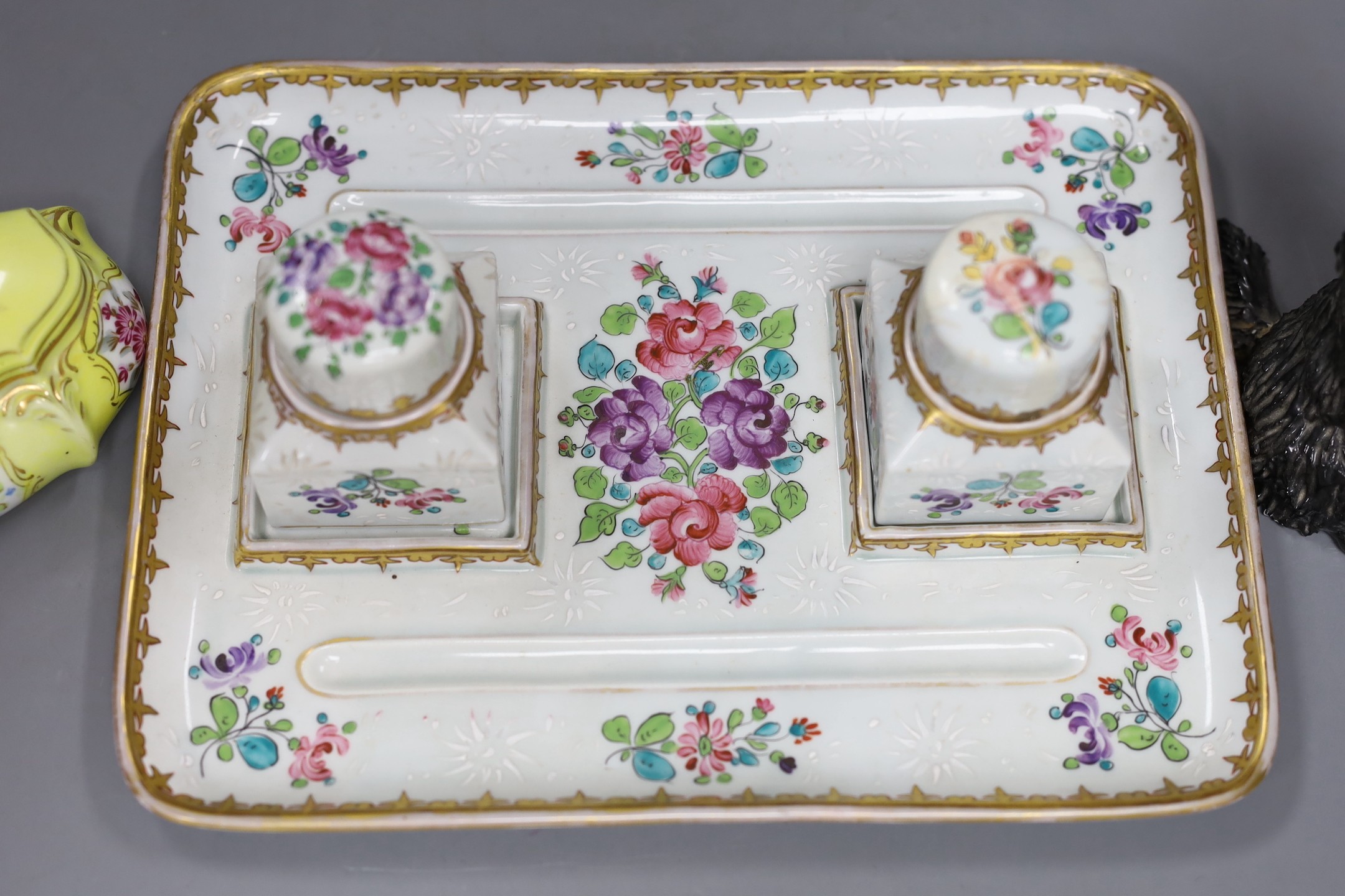 A Samson Paris inkstand and a porcelain box and cover and a porcelain model of a Scots terrier, inkstand 26cms wide